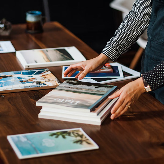 A man reviewing creative hotel branding materials for the travel and tourism industry