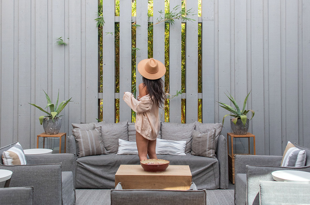 A woman standing in a relaxing lounge area